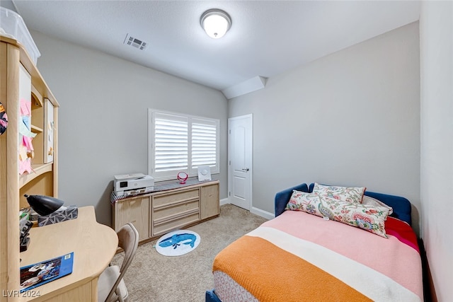 bedroom featuring light carpet