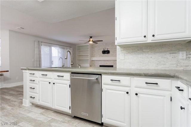 kitchen featuring kitchen peninsula, ceiling fan, stainless steel dishwasher, white cabinets, and sink