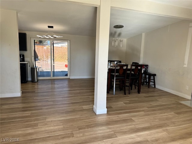 dining room with wood-type flooring