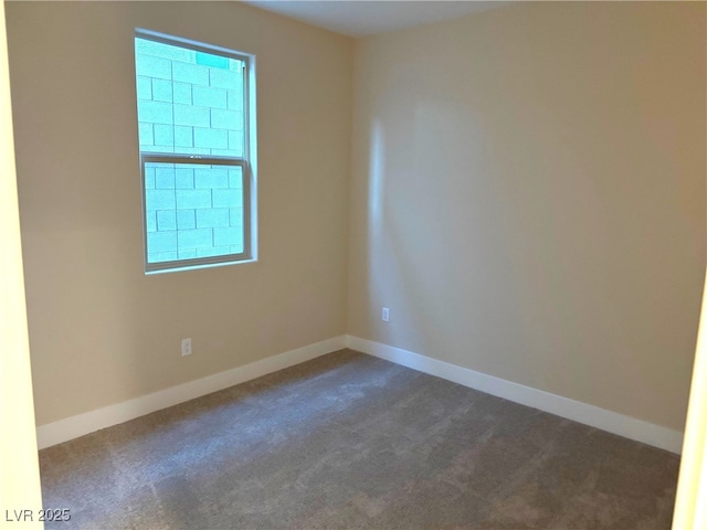 empty room with dark carpet