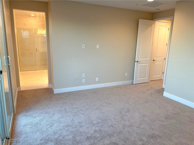 unfurnished room featuring light colored carpet