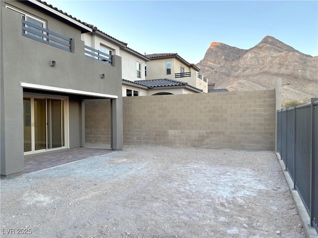 view of yard with a mountain view and a patio area