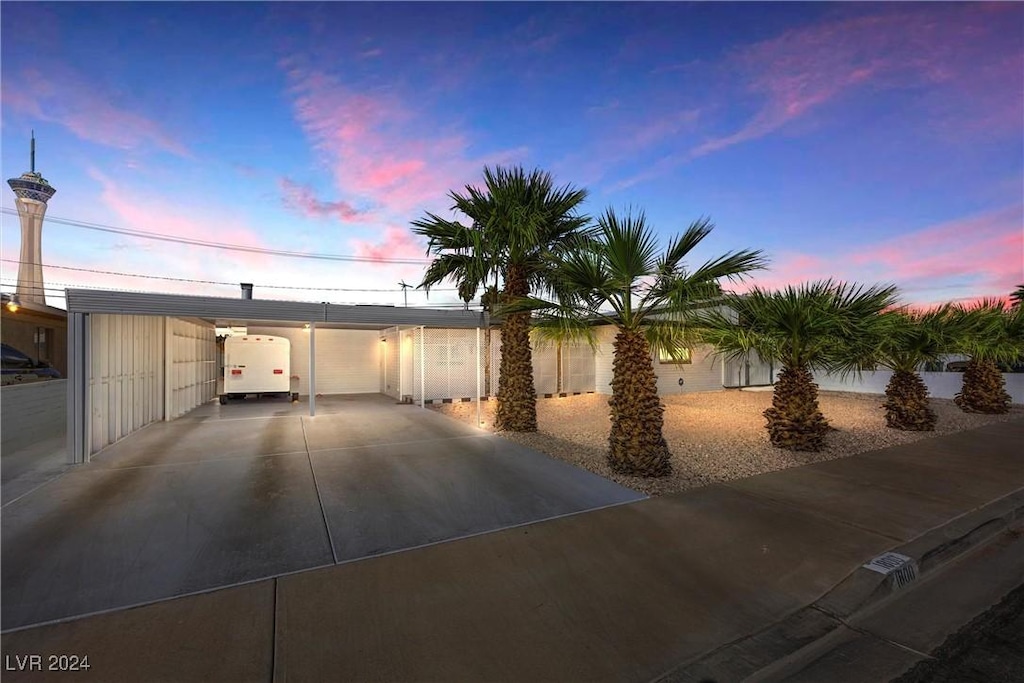 view of front of home with a carport