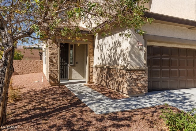 property entrance with a garage