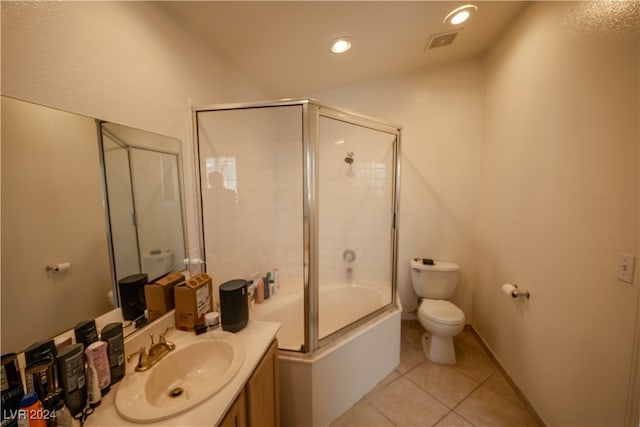 full bathroom with vanity, enclosed tub / shower combo, toilet, and tile patterned floors