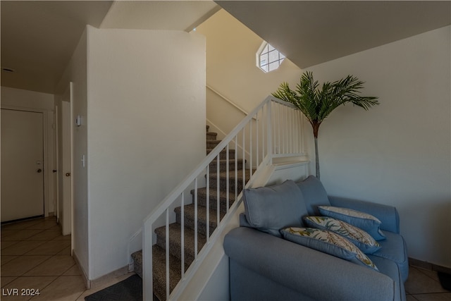 staircase with tile patterned floors