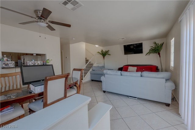 tiled living room featuring ceiling fan