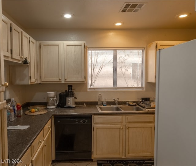 kitchen with dishwasher, white fridge, and sink