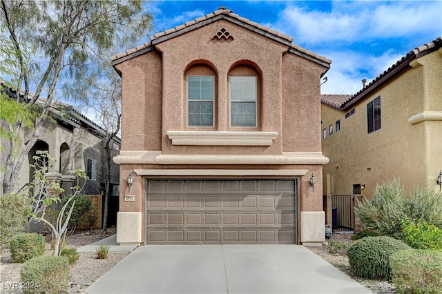 view of front of home with a garage