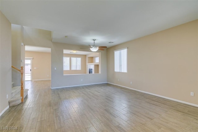 empty room featuring light hardwood / wood-style floors and ceiling fan