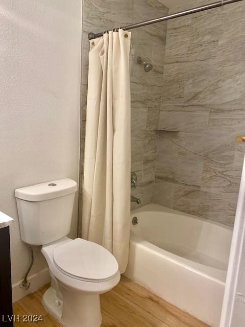 full bathroom with shower / bath combination with curtain, wood-type flooring, vanity, and toilet