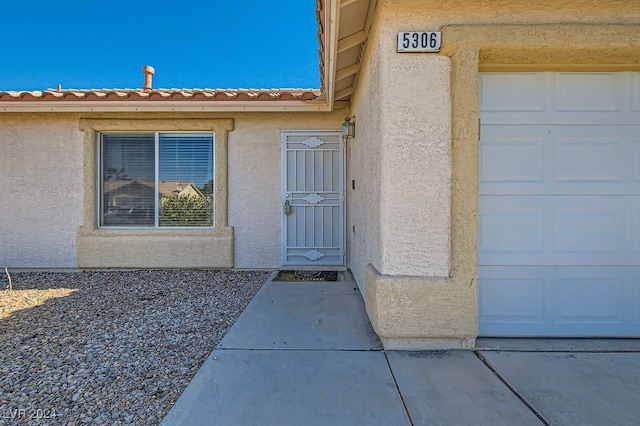 property entrance with a garage