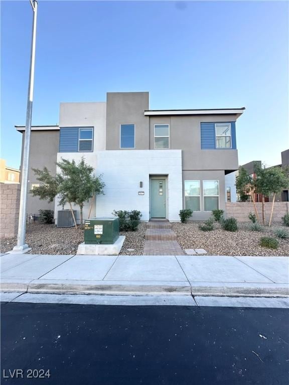 9847 Kings Glen St, Las Vegas, NV 89141 - view of front of home with fence, stucco siding, and central AC unit