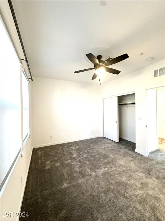 9847 Kings Glen St, Las Vegas, NV 89141 - unfurnished bedroom with carpet floors, baseboards, and ceiling fan