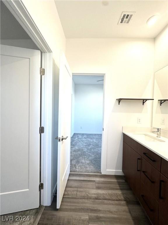 9847 Kings Glen St, Las Vegas, NV 89141 - bathroom featuring wood finished floors, vanity, and baseboards