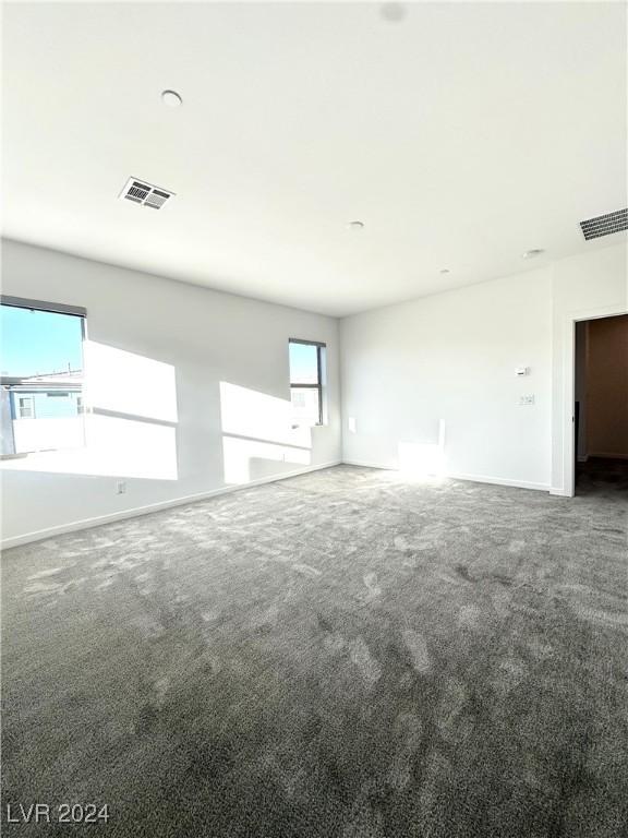 9847 Kings Glen St, Las Vegas, NV 89141 - carpeted spare room with baseboards