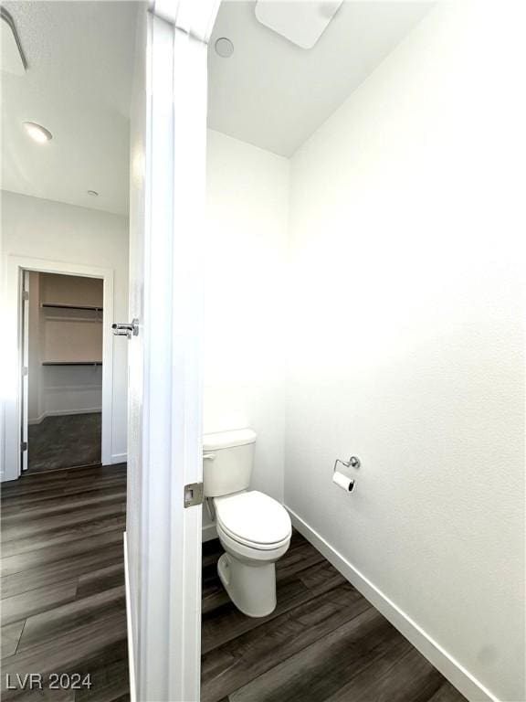 9847 Kings Glen St, Las Vegas, NV 89141 - bathroom featuring toilet, wood finished floors, and baseboards