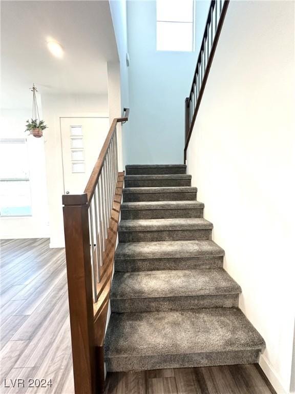 9847 Kings Glen St, Las Vegas, NV 89141 - stairs with wood finished floors and healthy amount of natural light