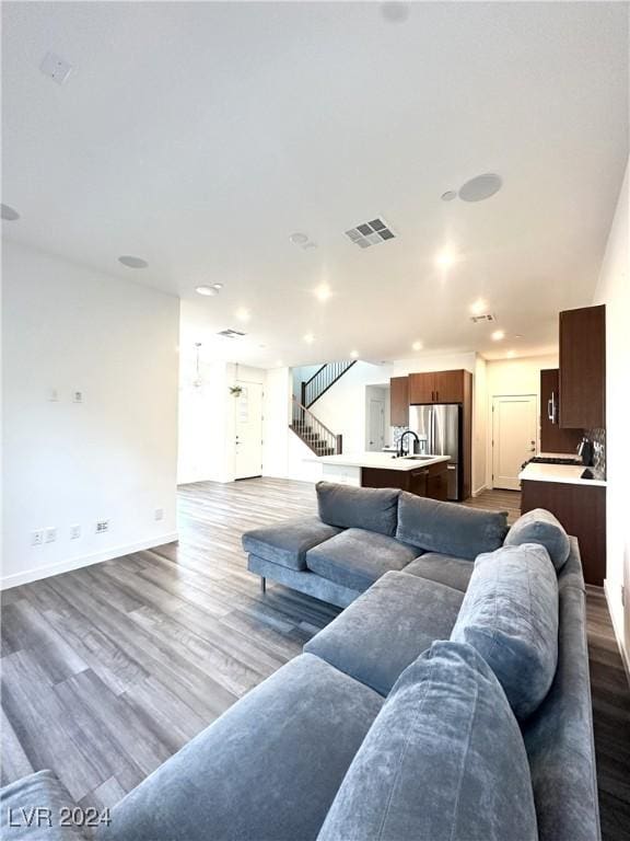 9847 Kings Glen St, Las Vegas, NV 89141 - living room with dark wood-style floors, recessed lighting, and baseboards