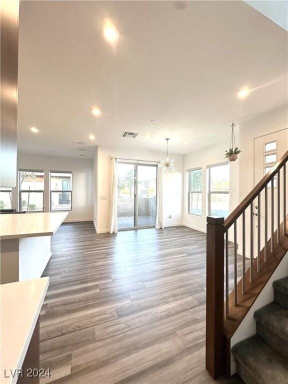 9847 Kings Glen St, Las Vegas, NV 89141 - living room with baseboards, stairs, wood finished floors, plenty of natural light, and recessed lighting