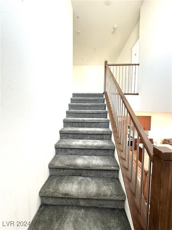 9847 Kings Glen St, Las Vegas, NV 89141 - stairs with carpet floors