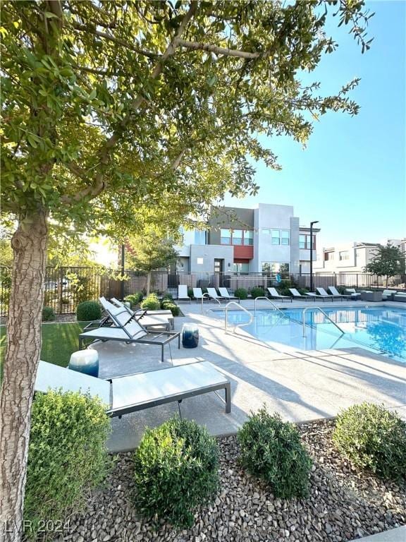 9847 Kings Glen St, Las Vegas, NV 89141 - community pool featuring fence and a patio area