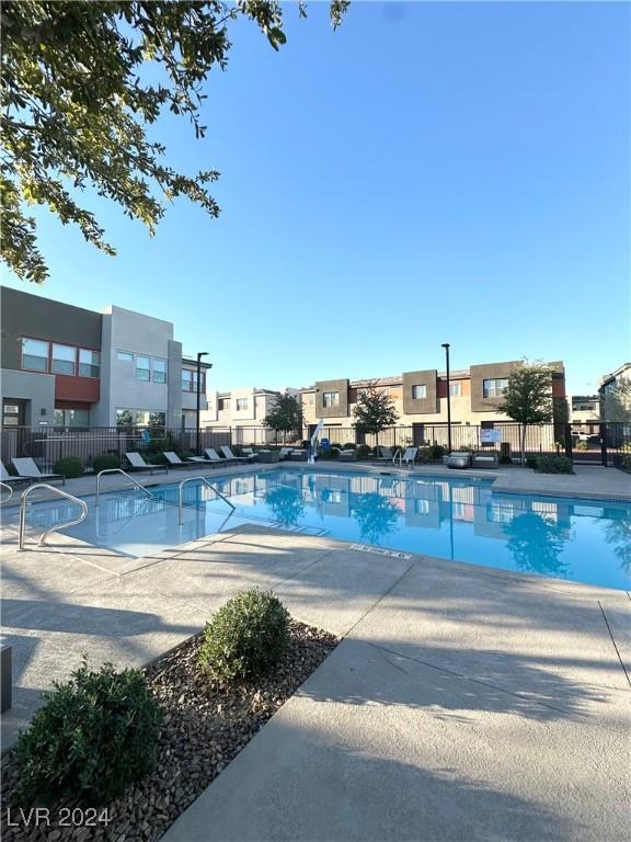 9847 Kings Glen St, Las Vegas, NV 89141 - community pool with fence and a patio area