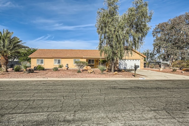 single story home featuring a garage