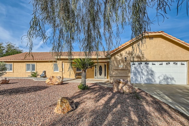 ranch-style home with a garage