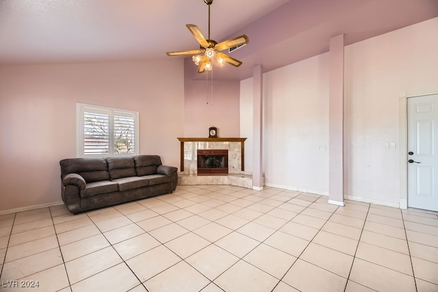 living room featuring high vaulted ceiling, ceiling fan, a premium fireplace, and light tile patterned floors