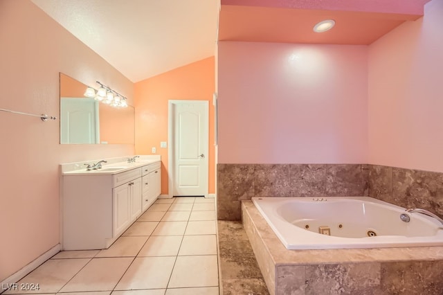 bathroom featuring tile patterned floors, tiled bath, vanity, and lofted ceiling