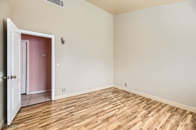 spare room featuring light hardwood / wood-style floors