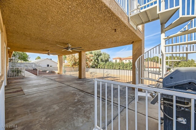 view of patio featuring ceiling fan and a grill