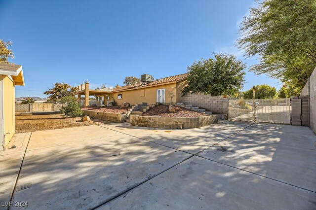 back of property featuring a patio area