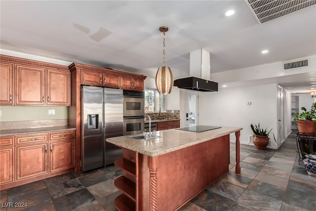 kitchen featuring a center island with sink, sink, appliances with stainless steel finishes, decorative light fixtures, and island exhaust hood