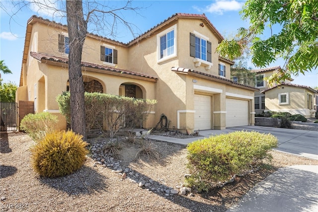 mediterranean / spanish-style house featuring a garage