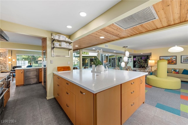 kitchen featuring a skylight, pendant lighting, and wooden ceiling