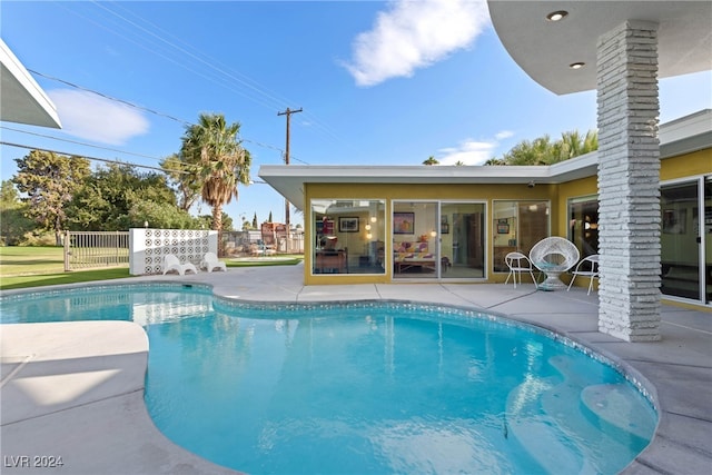 view of swimming pool with a patio