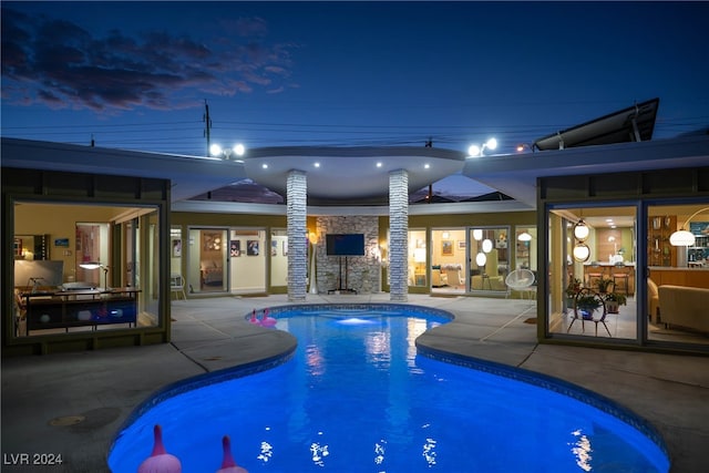 view of swimming pool with a patio