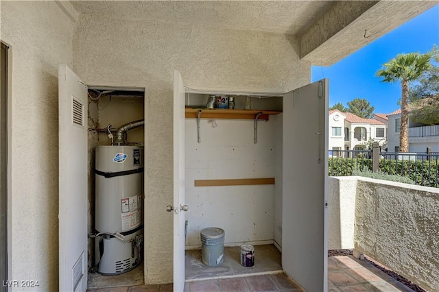 utility room with secured water heater