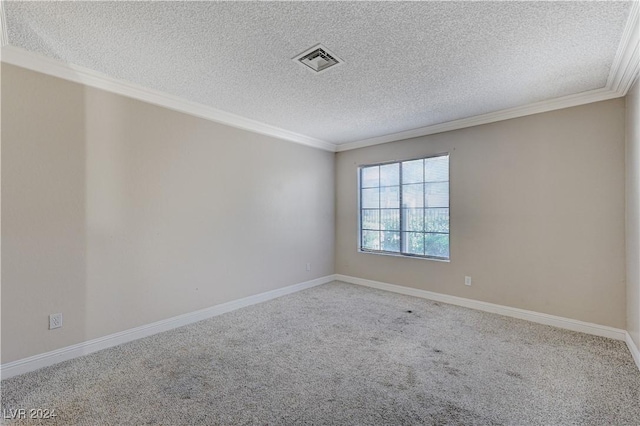 spare room with crown molding, carpet, and a textured ceiling