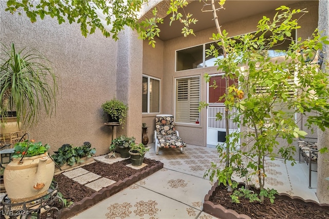 entrance to property with a patio area