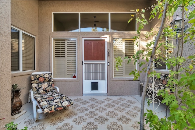 doorway to property with a patio