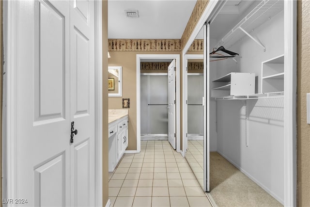 bathroom featuring tile patterned floors and vanity