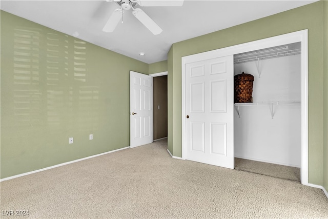 unfurnished bedroom featuring carpet, ceiling fan, and a closet