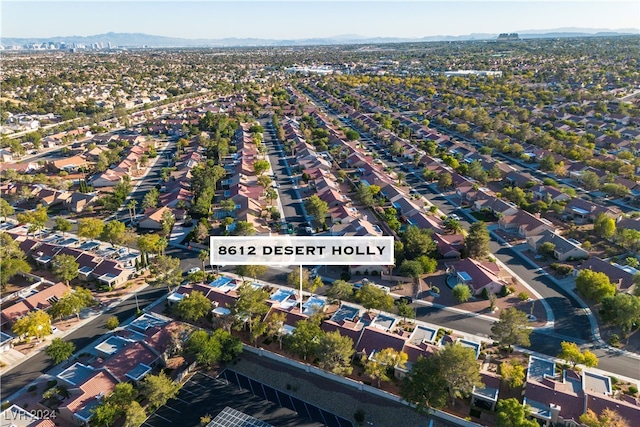 birds eye view of property with a mountain view