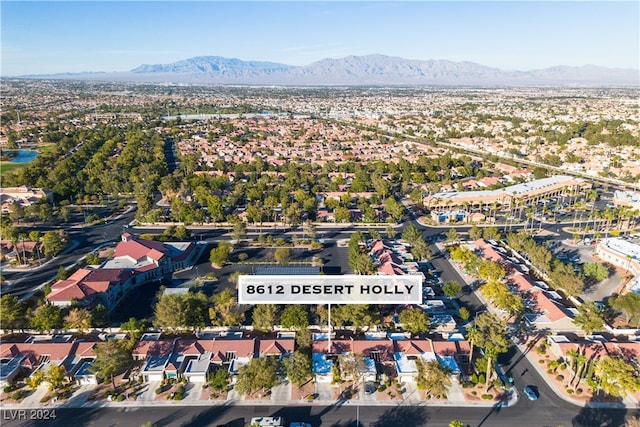 birds eye view of property with a mountain view