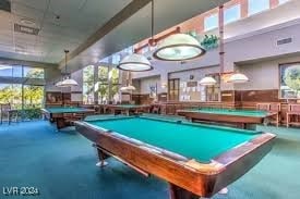 playroom with concrete flooring and billiards