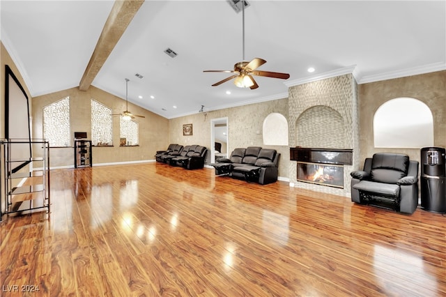 living room with ornamental molding, lofted ceiling with beams, and wood-type flooring