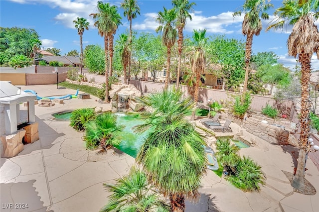 exterior space with a fenced in pool